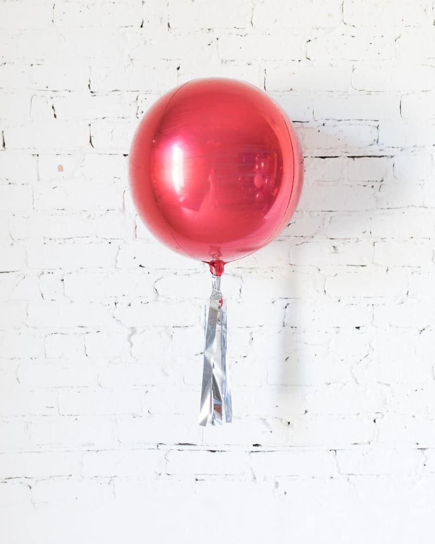 16in Red Orb Foil Balloon and Silver Skirt | Purchase