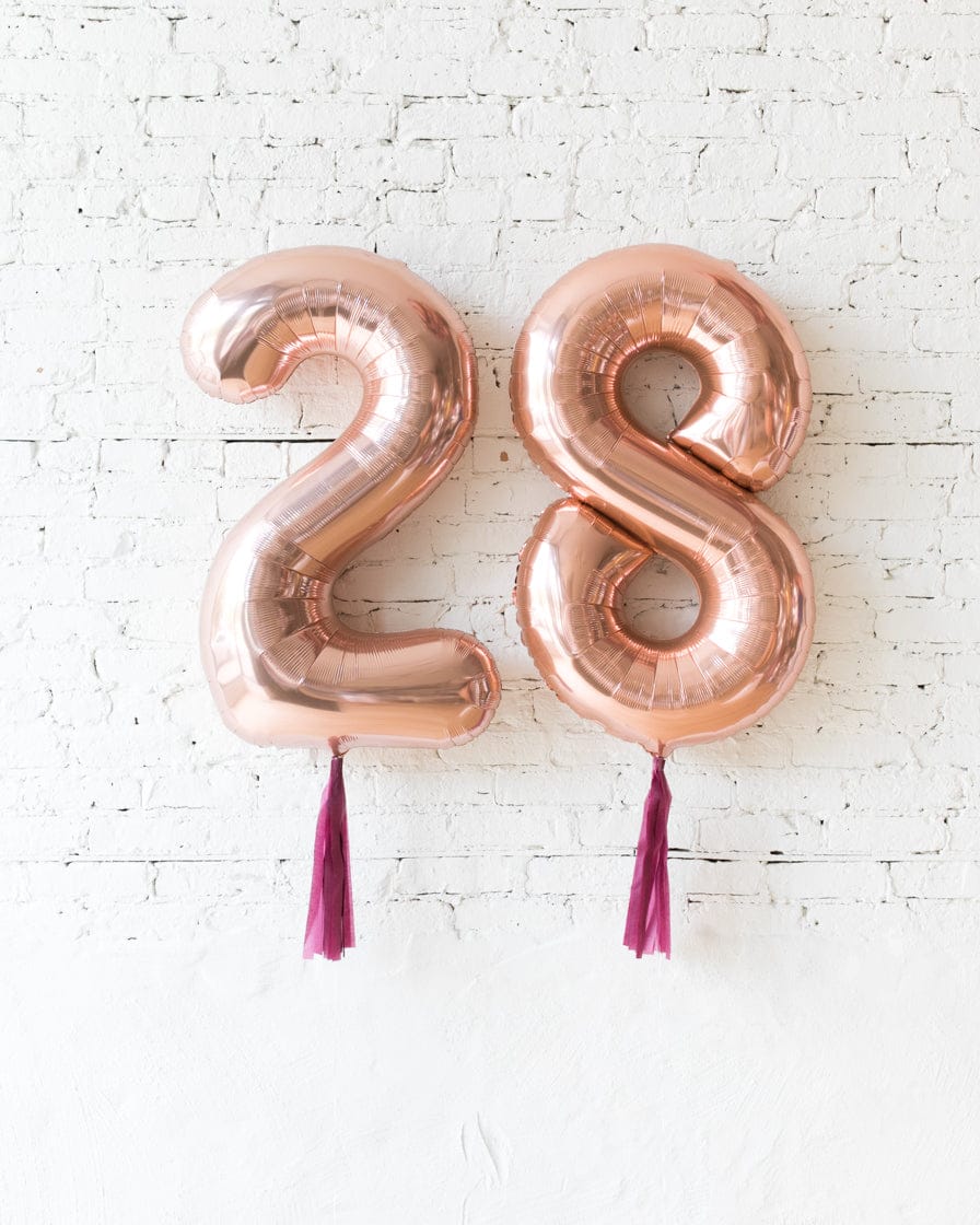 34in Rose Gold Foil Numbers with Burgundy Skirts | Rental