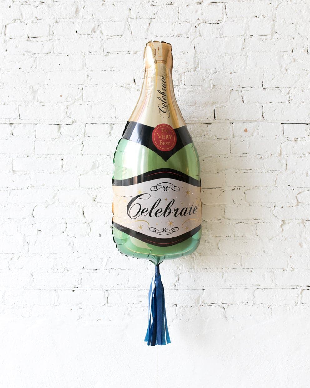 39in Classic Champagne Bottle Foil Balloon and Navy Skirt | Rental