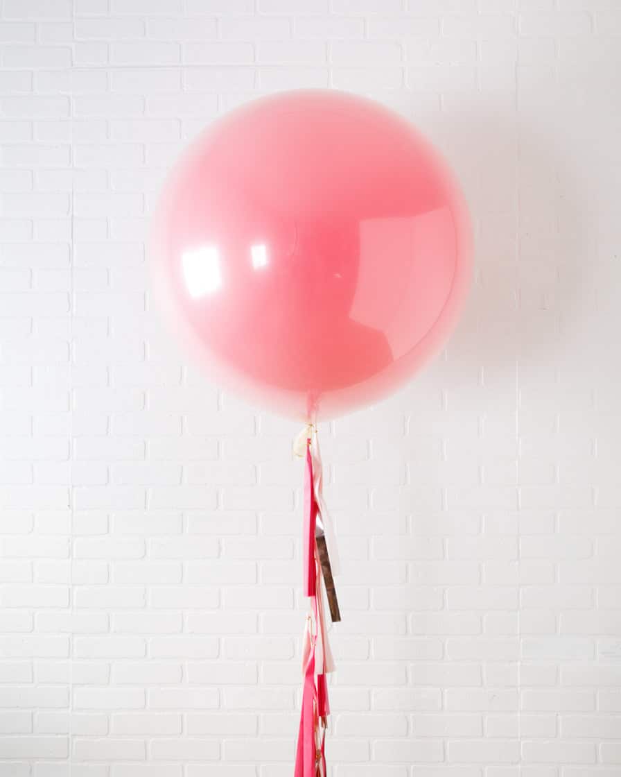 Life In Plastic – Giant Balloon with Tassel | Rental Life In Plastic – Giant Balloon with Tassel | Rental