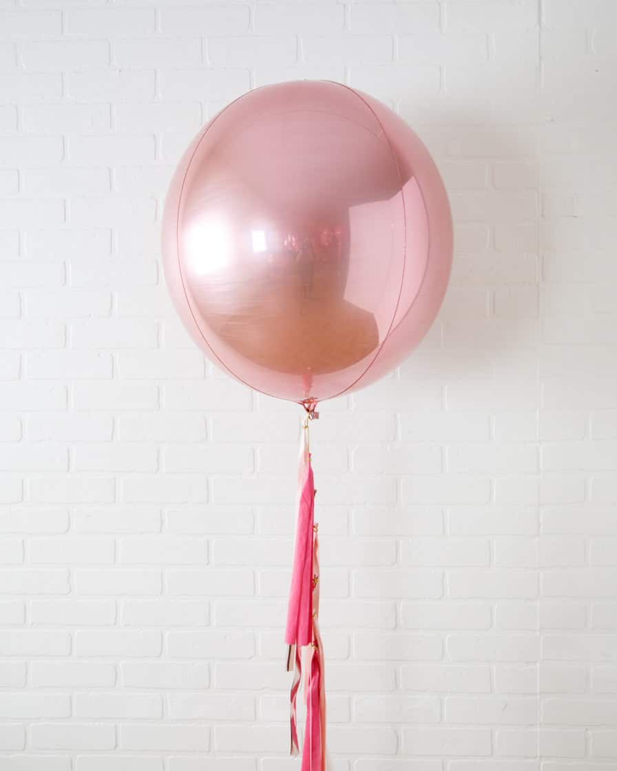 Life In Plastic – 21in Orb Foil Balloon with Half-Tassel | Rental Life In Plastic – 21in Orb Foil Balloon with Half-Tassel | Rental