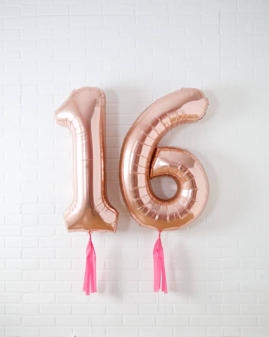 Life In Plastic – 34in Rose Gold Foil Numbers with Fuchsia Skirts | Rental Life In Plastic – 34in Rose Gold Foil Numbers with Fuchsia Skirts | Rental